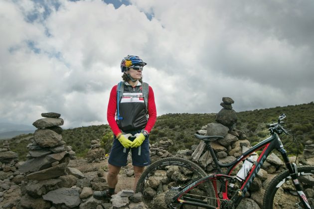 Rebecca Rusch poses for a portait after finishing the ride to Horombo Mawenzi Sadle, on an aclimatization day during her attempt to ascend Mount Kilimanjaro, Tanzania on 22 February, 2016. © Red Bull Media House